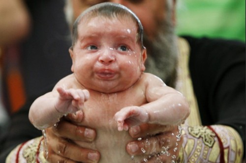 A baby was baptized during a mass ceremony in Tbilisi, Georgia, Friday.